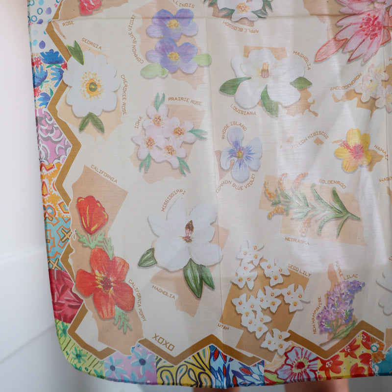 Floral patterned fabric with colorful designs on a white background