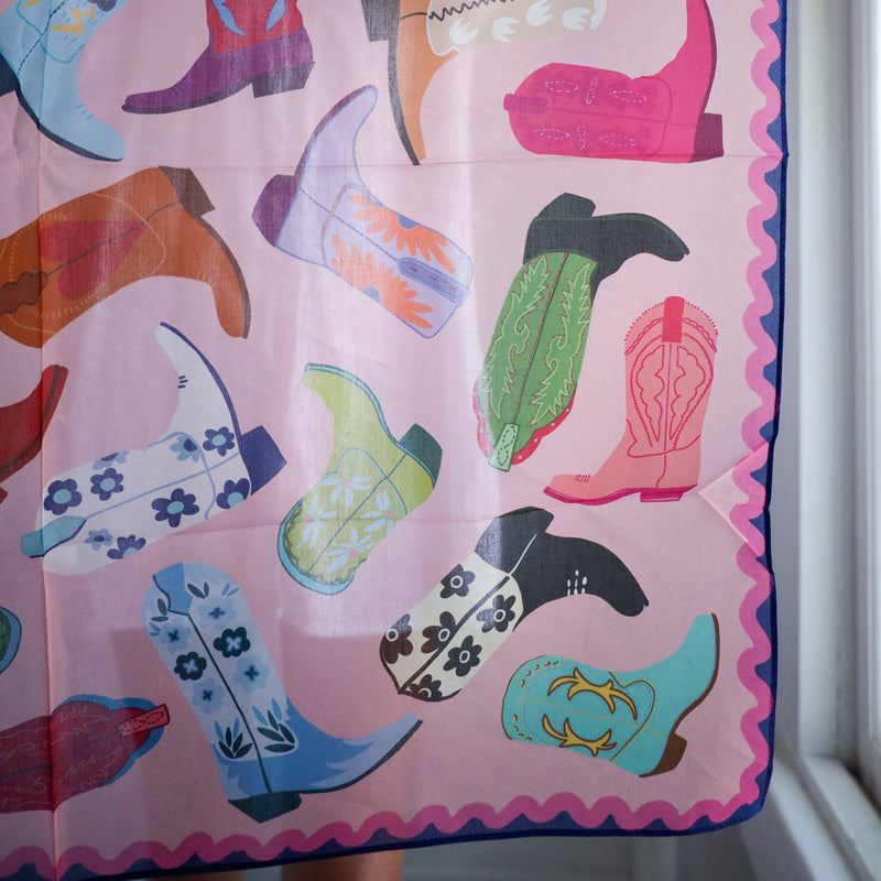 Colorful pattern of boots on a pink background
