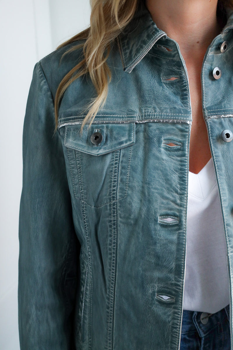 Denim jacket worn by a person with a white background