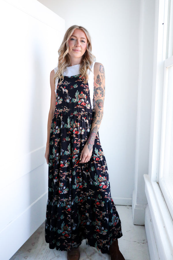 Woman wearing a floral dress in a bright room