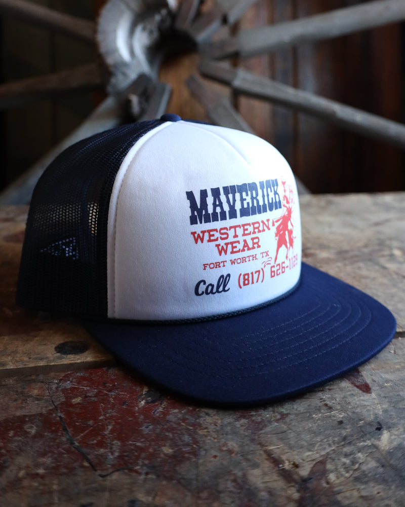 Trucker hat with 'Maverick Western Wear' branding on a rustic wooden surface.