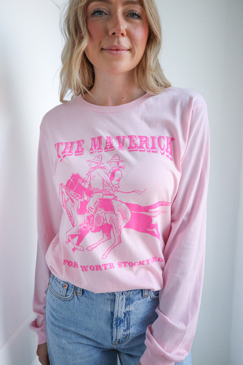 Person wearing a pink long-sleeve shirt with 'The Maverick' graphic design on a white background