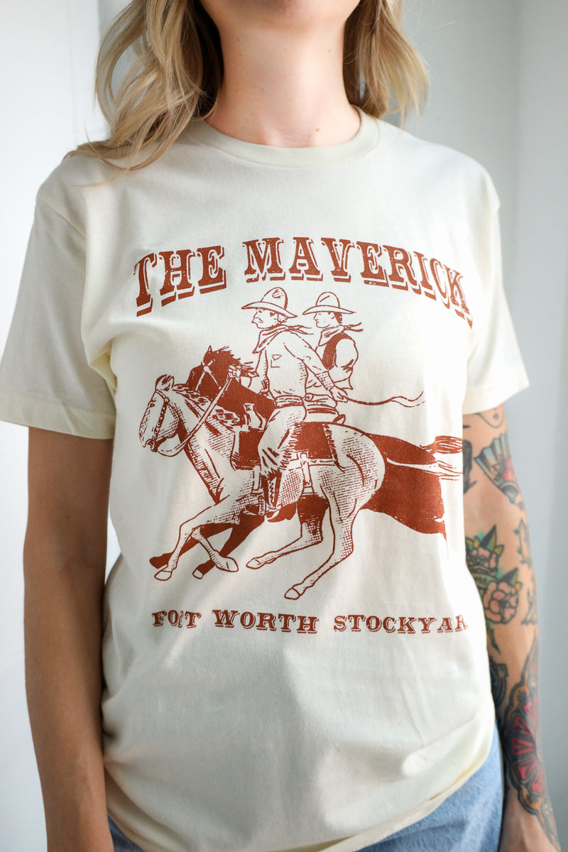 Person wearing a t-shirt with 'The Maverick Fort Worth Stockyard' graphic design.