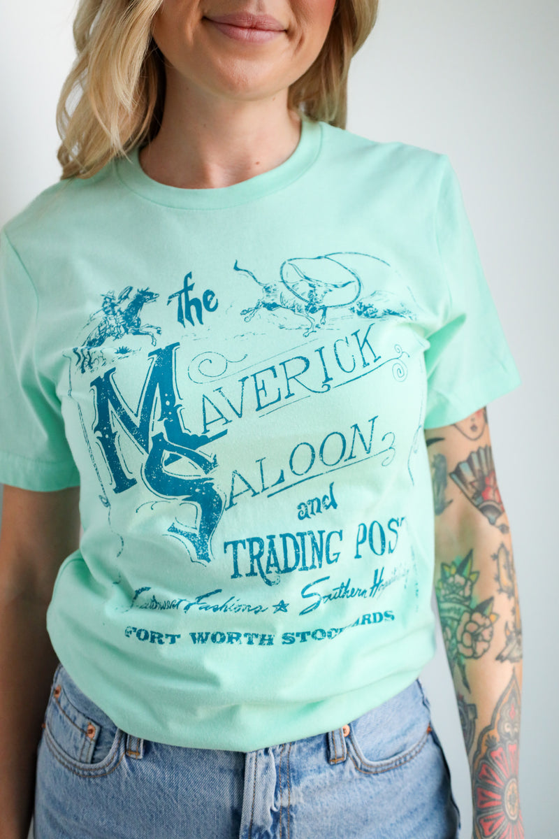 Person wearing a light blue t-shirt with a graphic design and text.