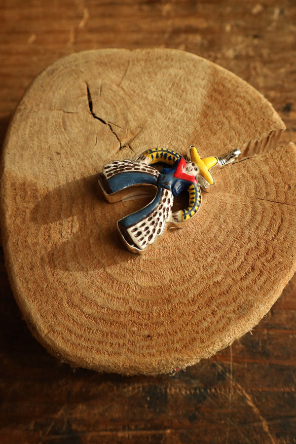 Colorful cowboy figurine on a wooden surface