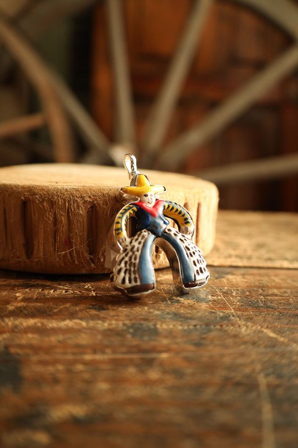 Colorful cowboy figurine on a wooden surface