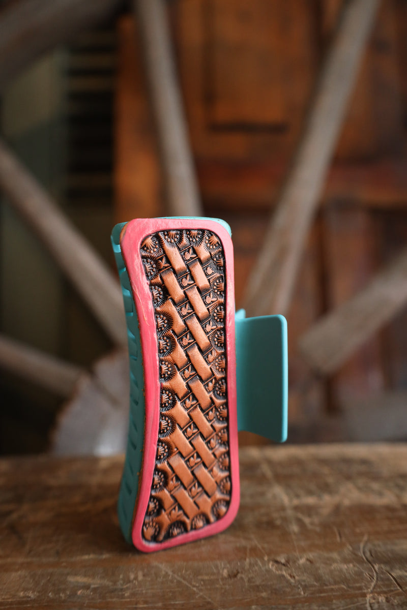 Phone case with woven design on a wooden surface