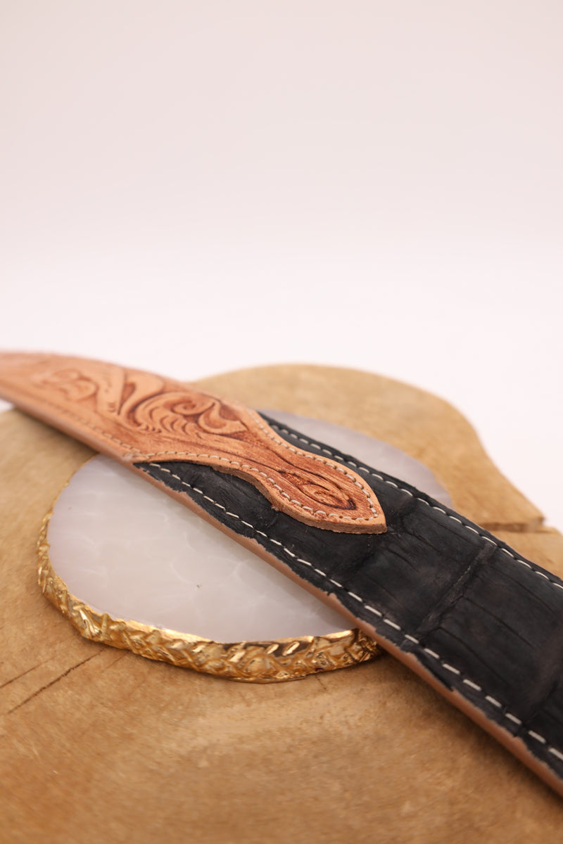 Black caiman belt with tooled leather on the front in a floral pattern