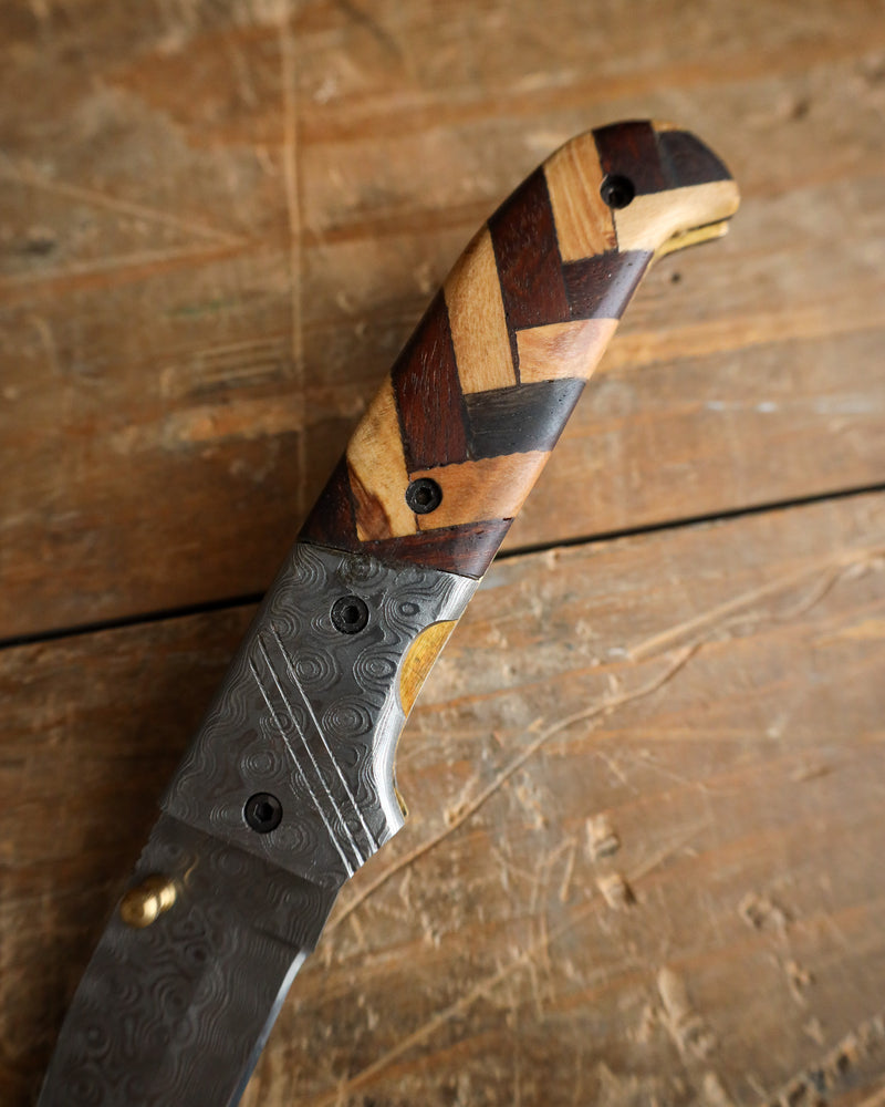 Forked handle knife with wooden pattern on a wooden surface