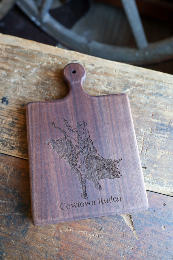 BULLRIDER COWTOWN RODEO 9X6 WALNUT BOARD