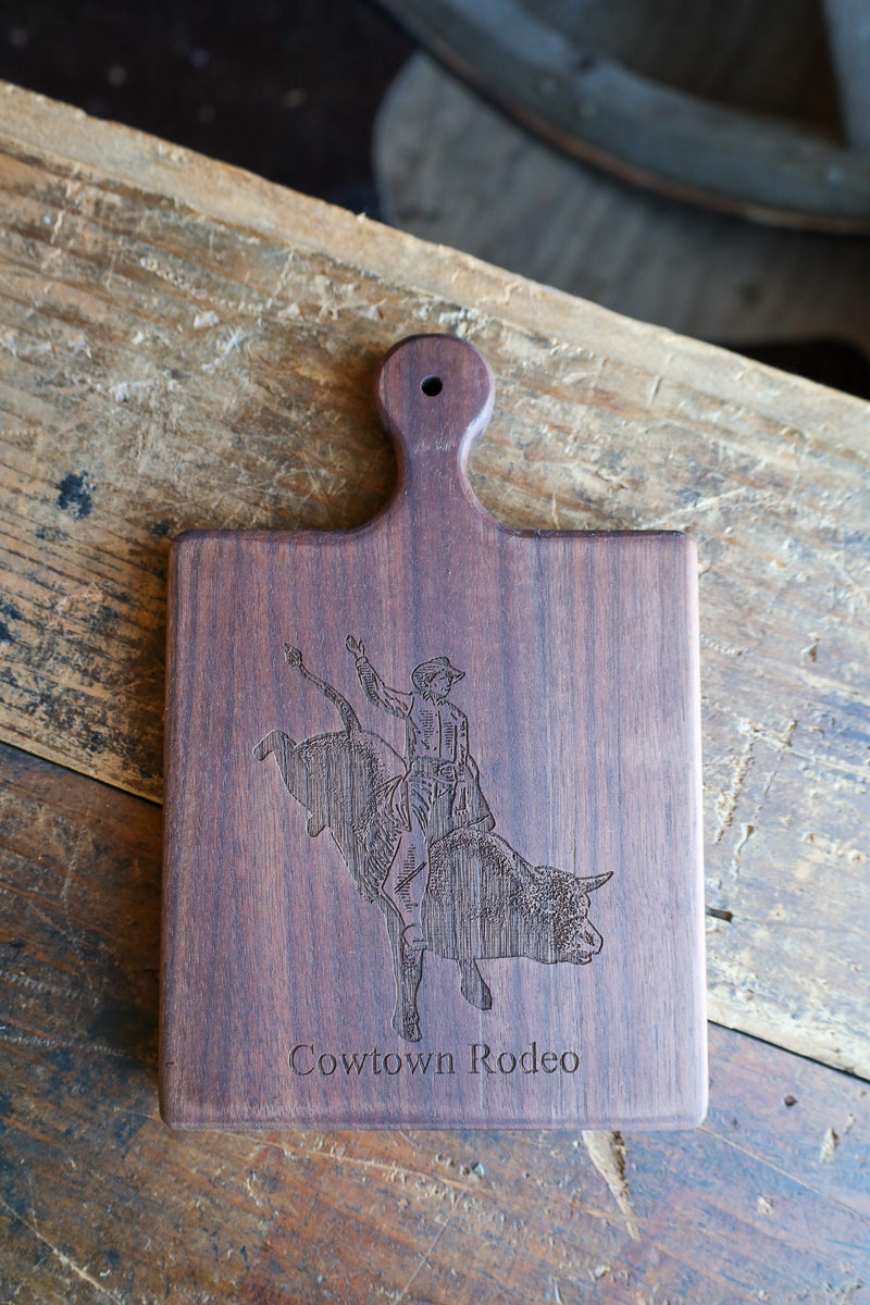 BULLRIDER COWTOWN RODEO 9X6 WALNUT BOARD