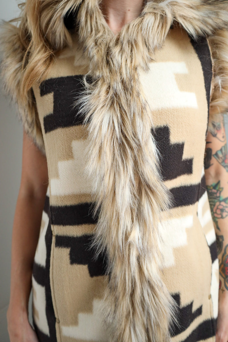 Vest with fur trim and geometric pattern