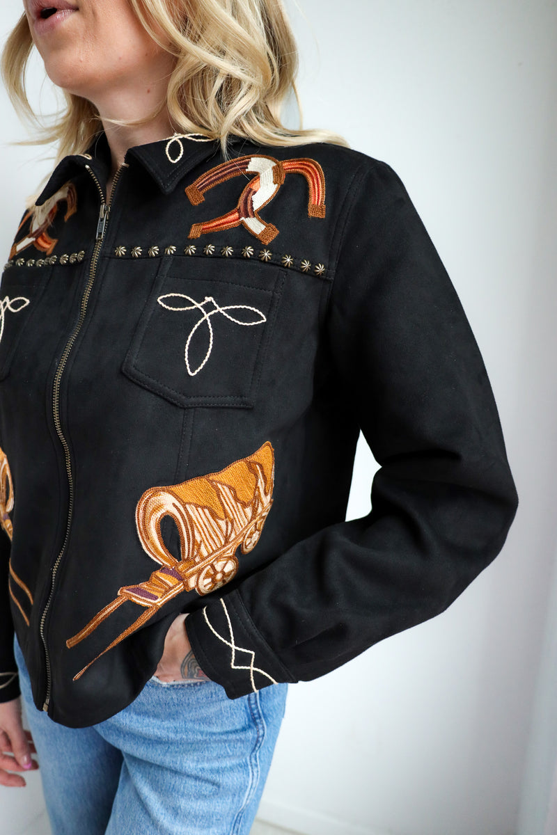 Black jacket with horse embroidery on a plain background