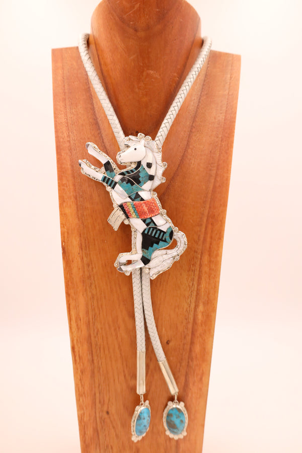 Mother of Pearl horse bolo tie that is adorned and inlaid with white shell, turquoise, and Acoma black jet along with turquoise tips.