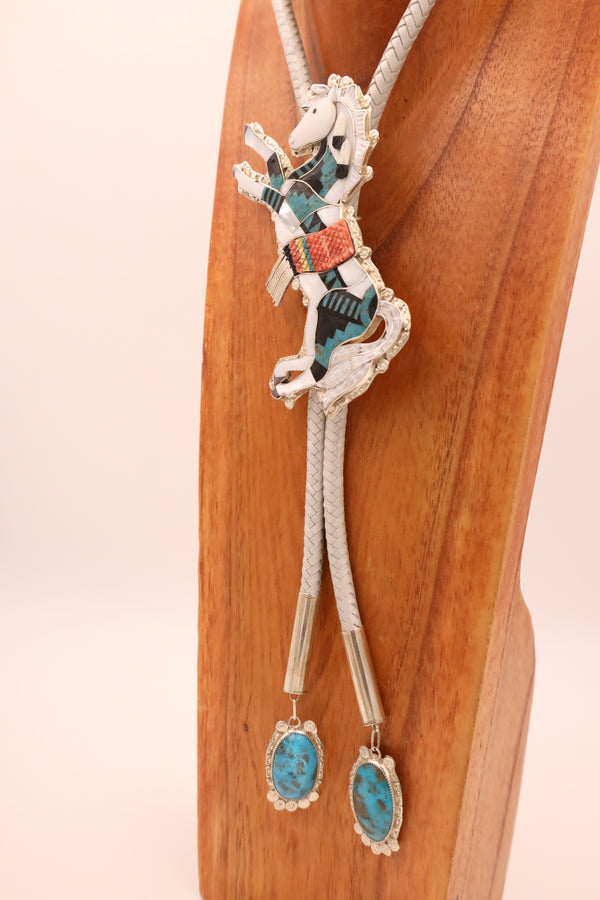  Mother of Pearl horse bolo tie that is adorned and inlaid with white shell, turquoise, and Acoma black jet along with turquoise tips.