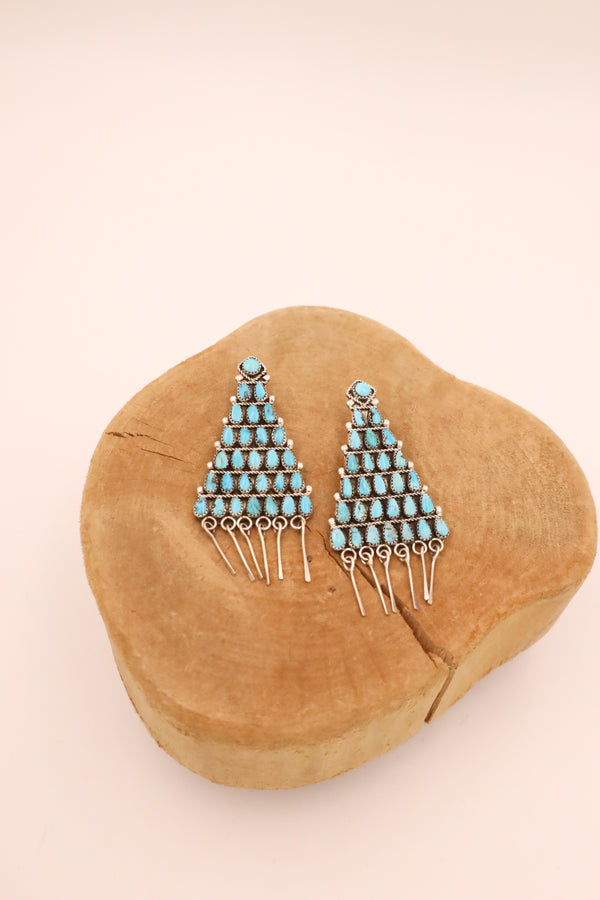 Sterling silver and turquoise earrings in the shape of a triangle with sterling silver dangles at the end