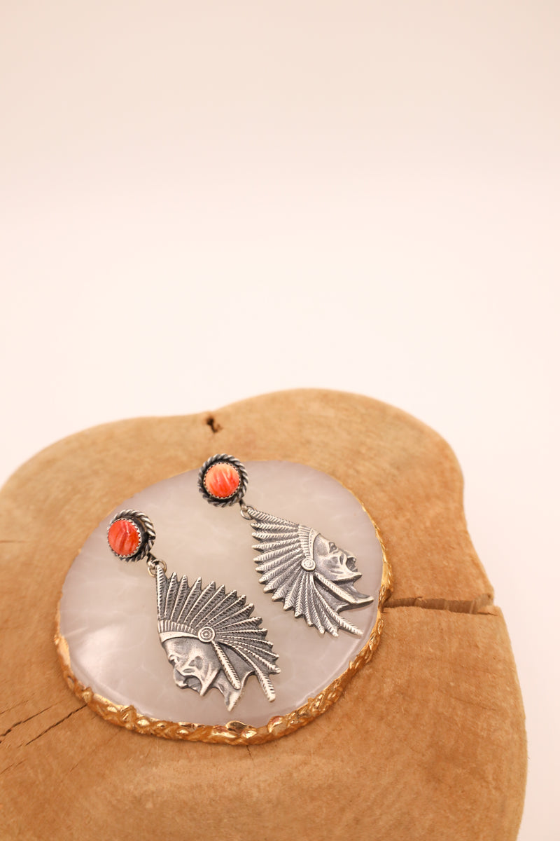 Sterling silver earring features a beautifully detailed chief head design with spiny oyster dot posts.