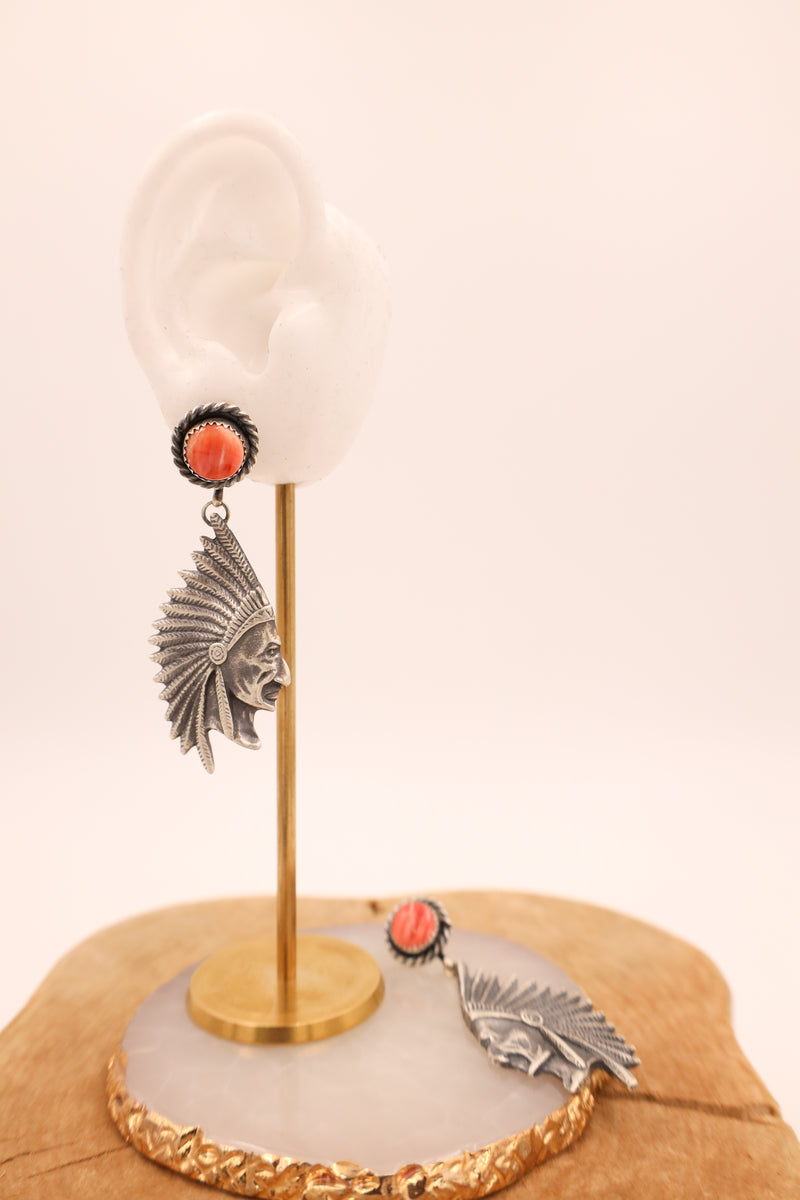 Sterling silver earring features a beautifully detailed chief head design with spiny oyster dot posts.