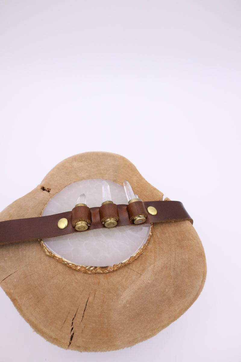 Featuring genuine leather, crystal adorned shotgun shells and an adjustable tie, this hatband is the perfect way to elevate your western style.