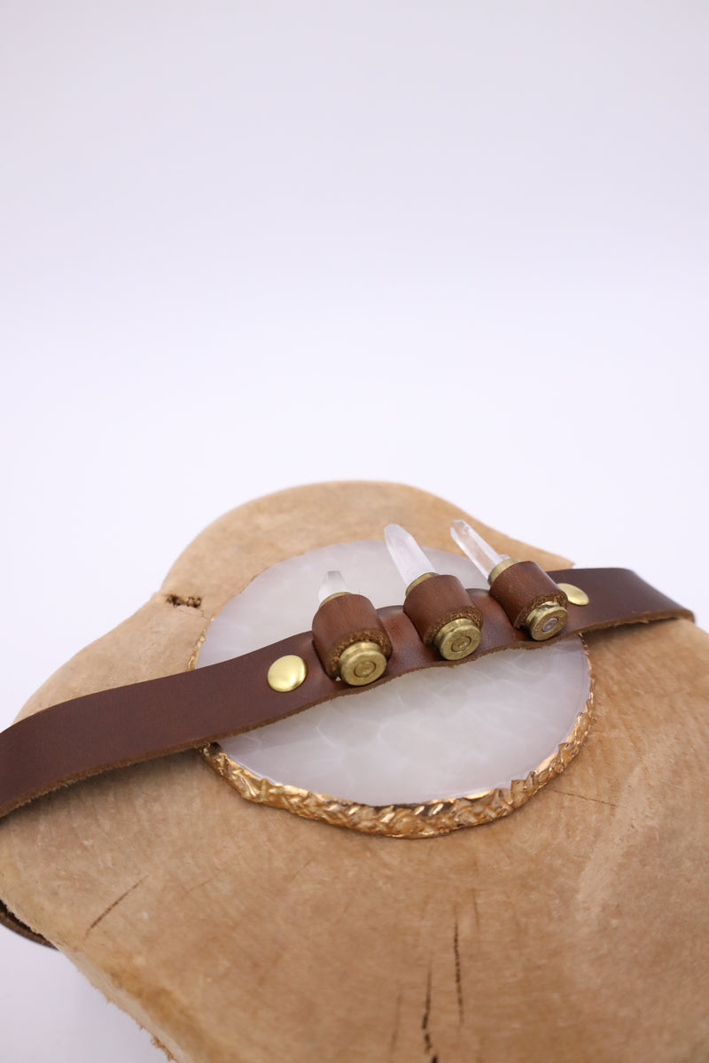 Featuring genuine leather, crystal adorned shotgun shells and an adjustable tie, this hatband is the perfect way to elevate your western style.