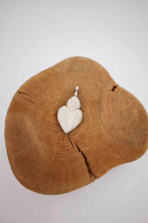 White heart pendant with crown on the top 