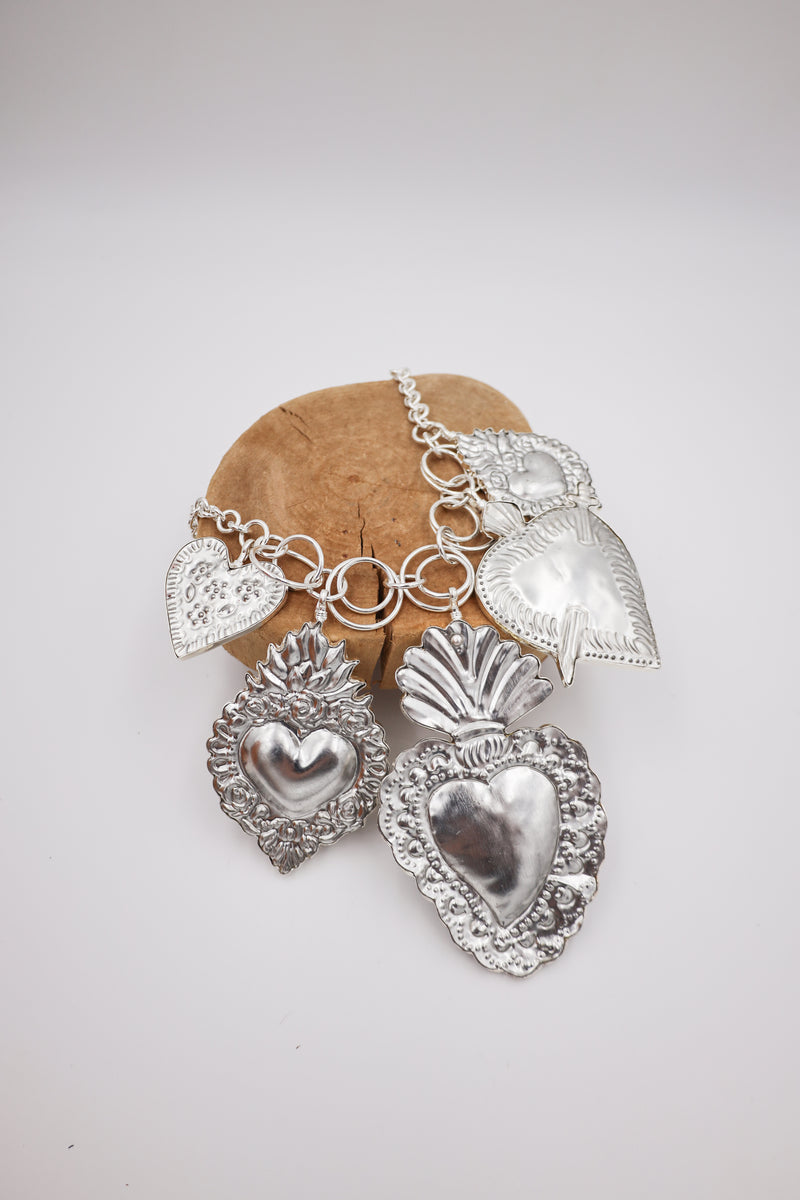 Necklace with five various heart in silver on a charm necklace