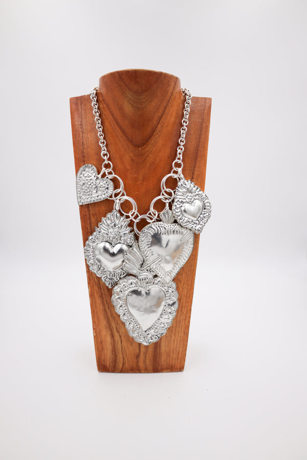 Necklace with five various heart in silver on a charm necklace