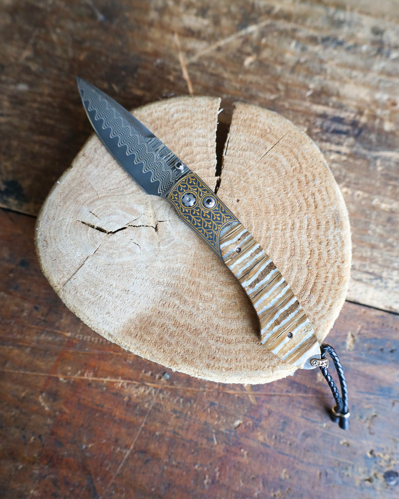 WILLIAM HENRY Sierra Pocketknife with 24K gold koftgari, fossil Mammoth Tooth, and 'wave' damascus blade