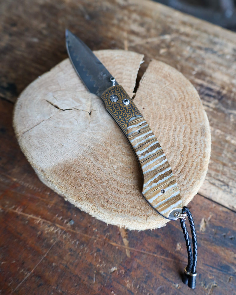 WILLIAM HENRY Sierra Pocketknife with 24K gold koftgari, fossil Mammoth Tooth, and 'wave' damascus blade