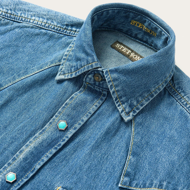 Men's denim shirt with turquoise snap buttons and double breast pockets. Additionally, this shirt has western yokes for the perfect western hint
