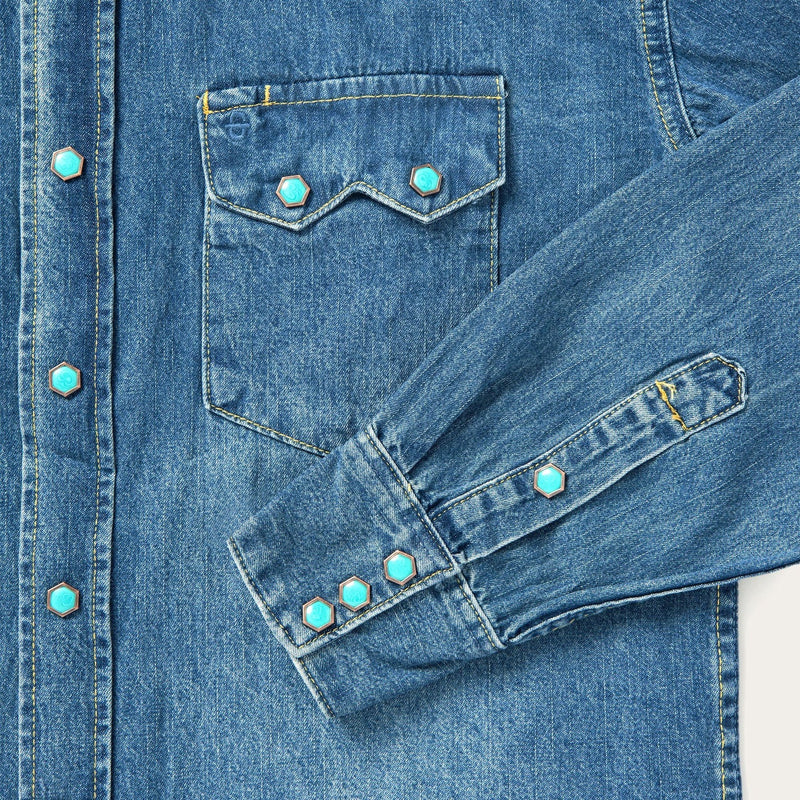 Men's denim shirt with turquoise snap buttons and double breast pockets. Additionally, this shirt has western yokes for the perfect western hint