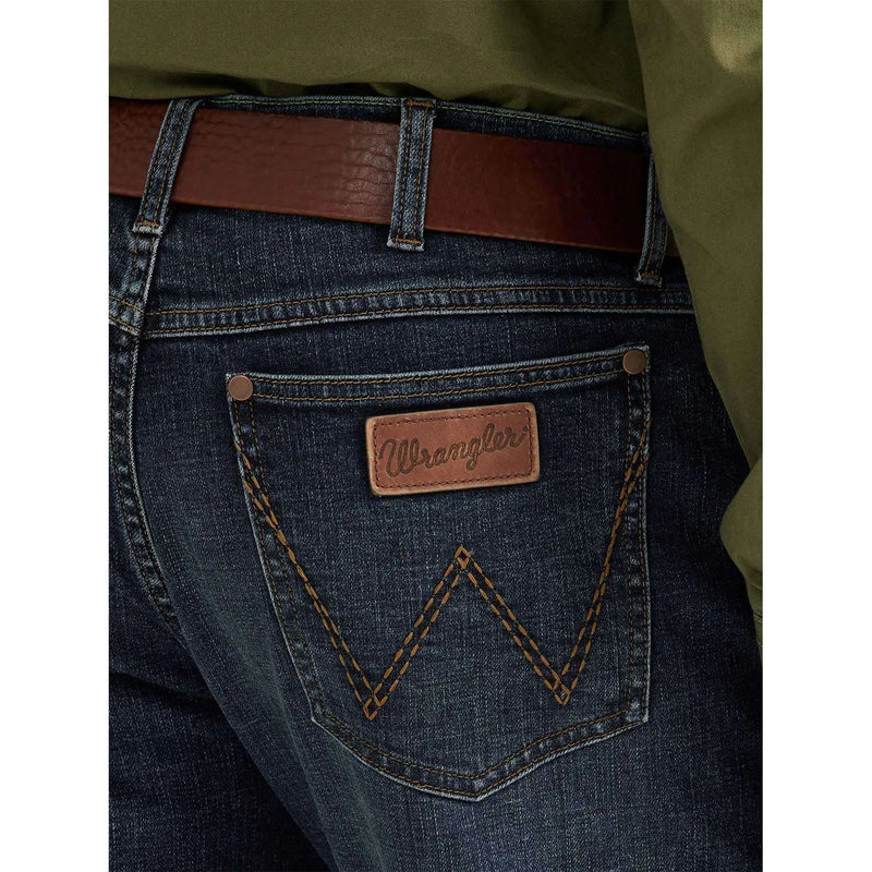 WRANGLER MEN'S SLIM STRAIGHT DENIM JEAN - Wrangler tag sewn on the black pocket above a big W stitching