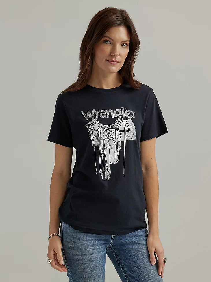 Woman wearing black t-shirt with "Wrangler for the ride of life" written near the image of a saddle