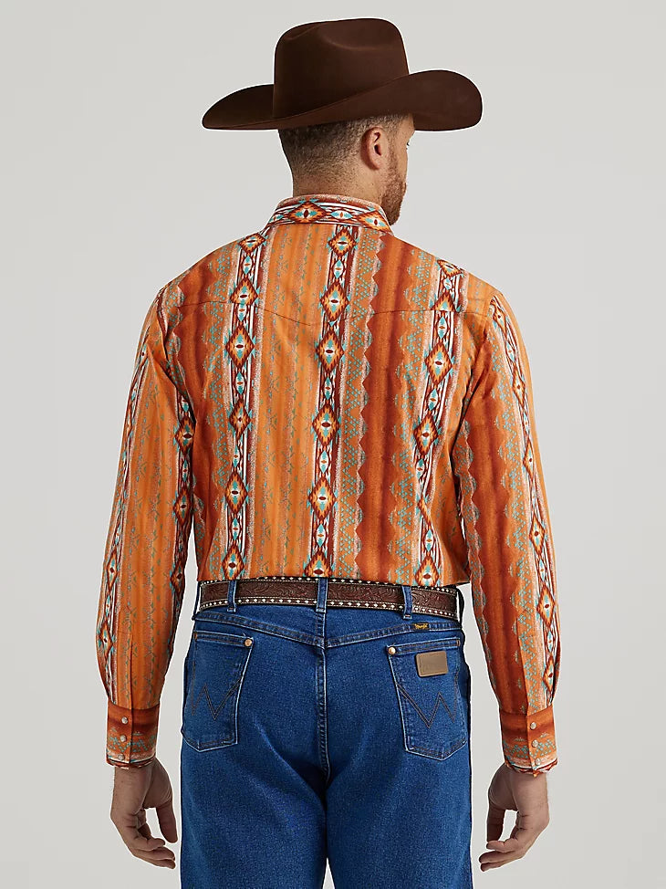 Man wearing Aztec and orange stripe shirt with double breast pockets and western yoke on shoulders and back