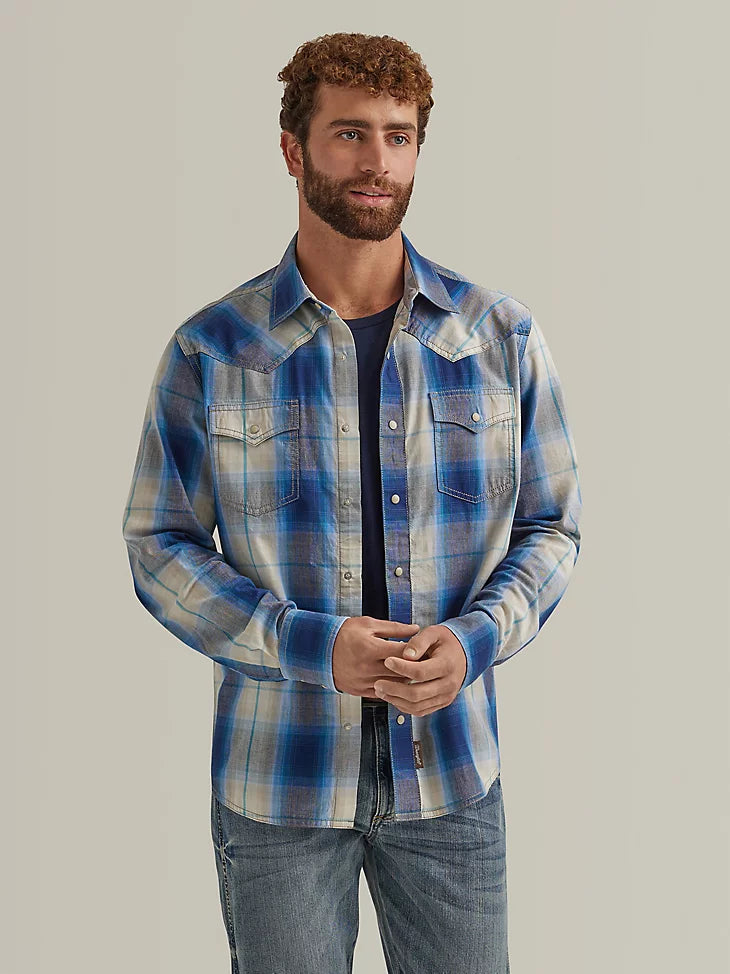 Man wearing blue plaid long-sleeved button up shirt with double breast pockets