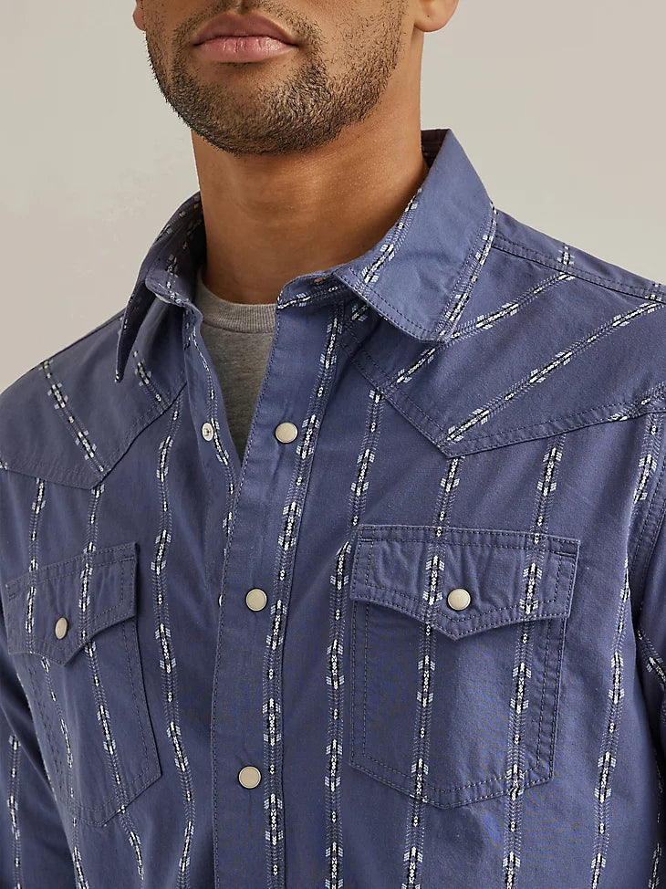 Man wearing blue button up shirt with dainty white design