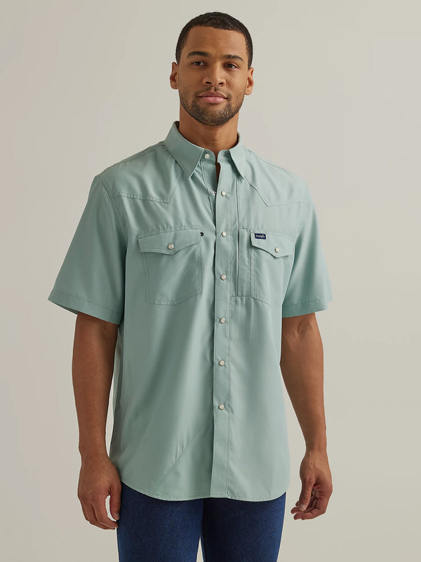 Man wearing performance short sleeve shirt with button front and vents in the back