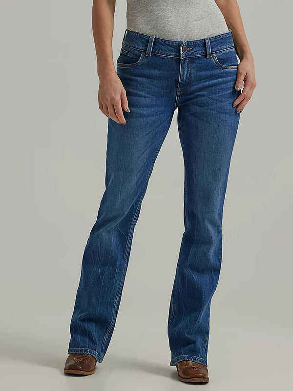 Woman wearing medium wash boot cut jeans