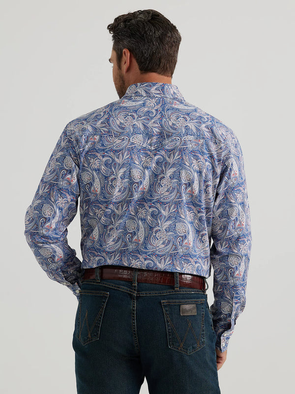 MAN WEARING BLUE LONG SLEEVE BUTTON FRONT SHIRT WITH PAISLEY PRINT