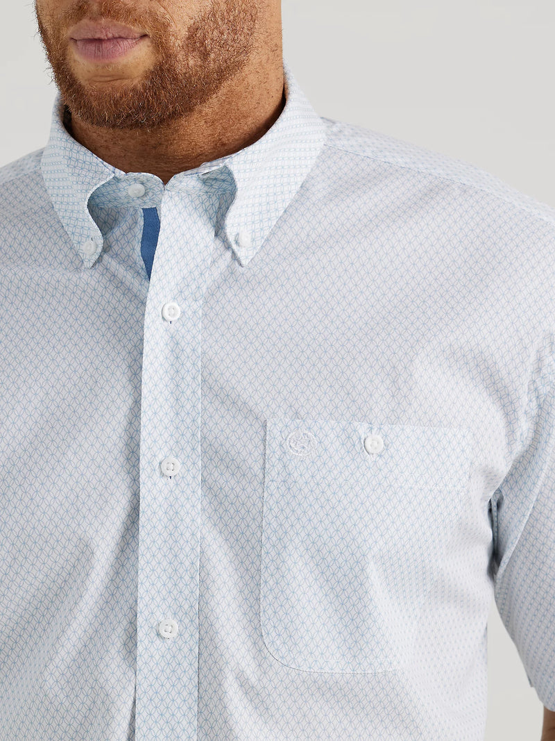 Man wearing short sleeve button down shirt in white and blue