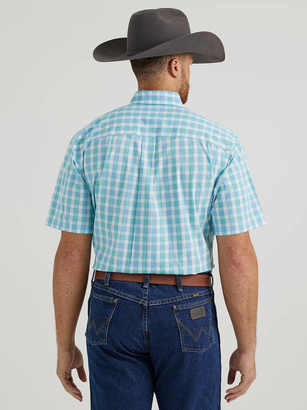 Man wearing white and blue plaid short sleeve button down shirt