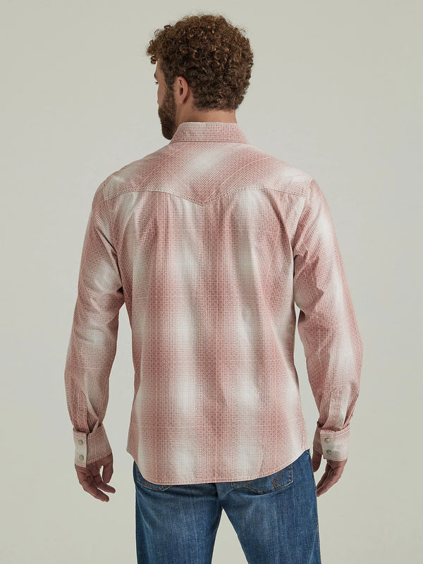 Man wearing red and white plaid long sleeve pearl snap shirt