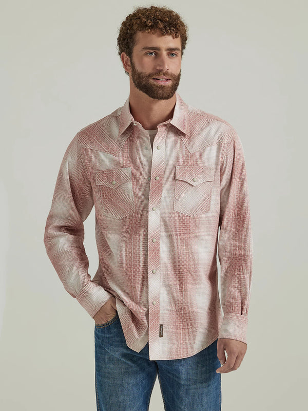 Man wearing red and white plaid long sleeve pearl snap shirt