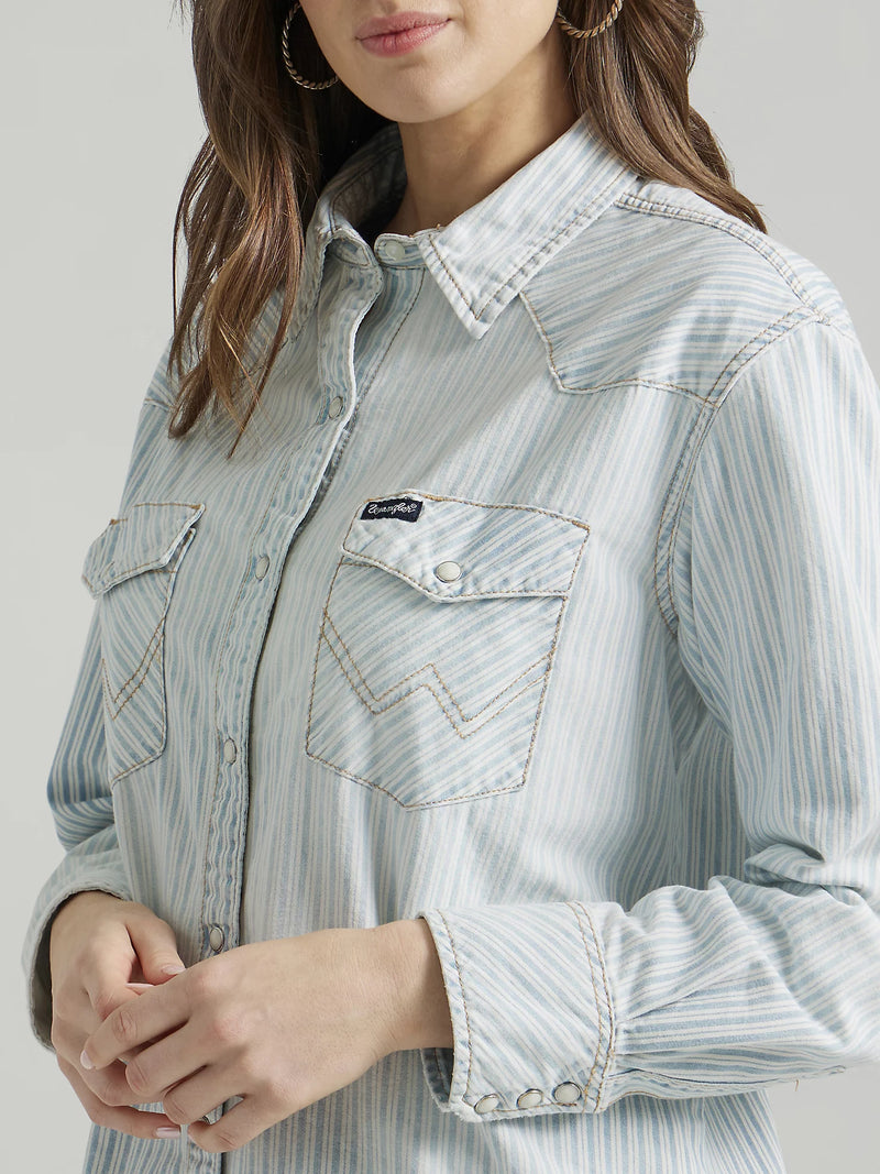 Woman wearing button front long sleeve button up shirt with stripes all over