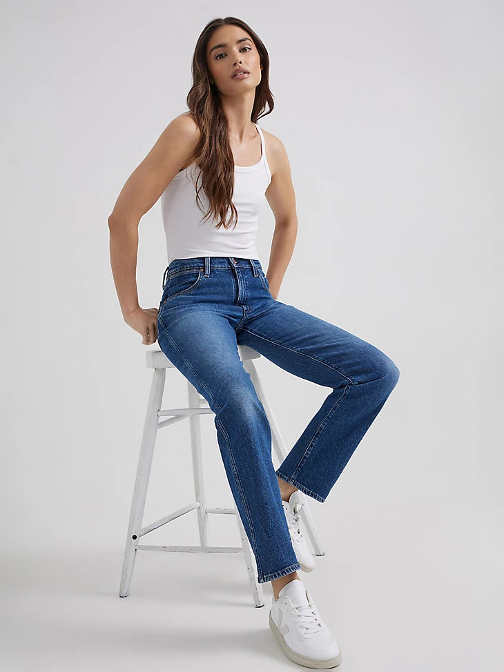 Woman wearing midrise straight jeans in a dark wash