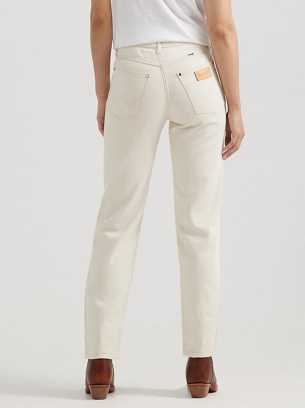 Woman wearing cream color mid rise straight leg jeans