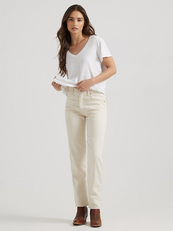 Woman wearing cream color mid rise straight leg jeans