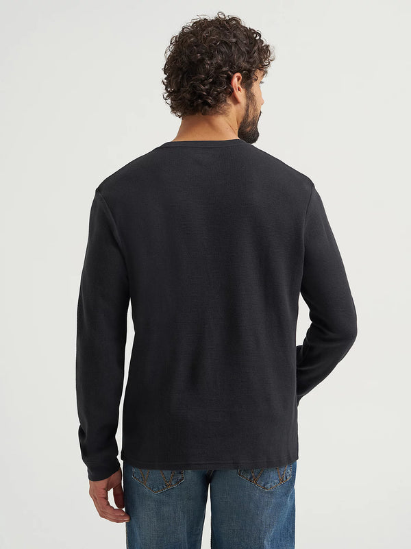 Man wearing a black long-sleeve shirt on a white background