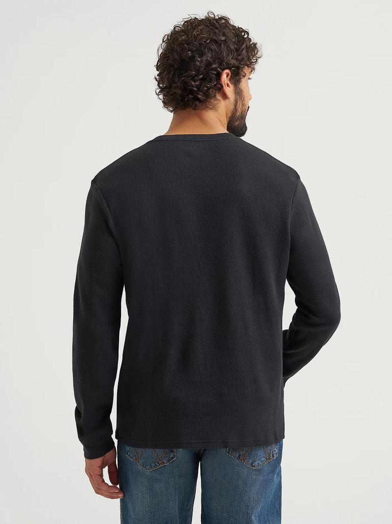 Man wearing a black long-sleeve shirt on a white background