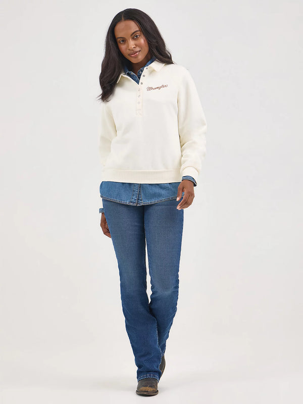 Woman wearing a white fleece jacket and blue jeans on a white background